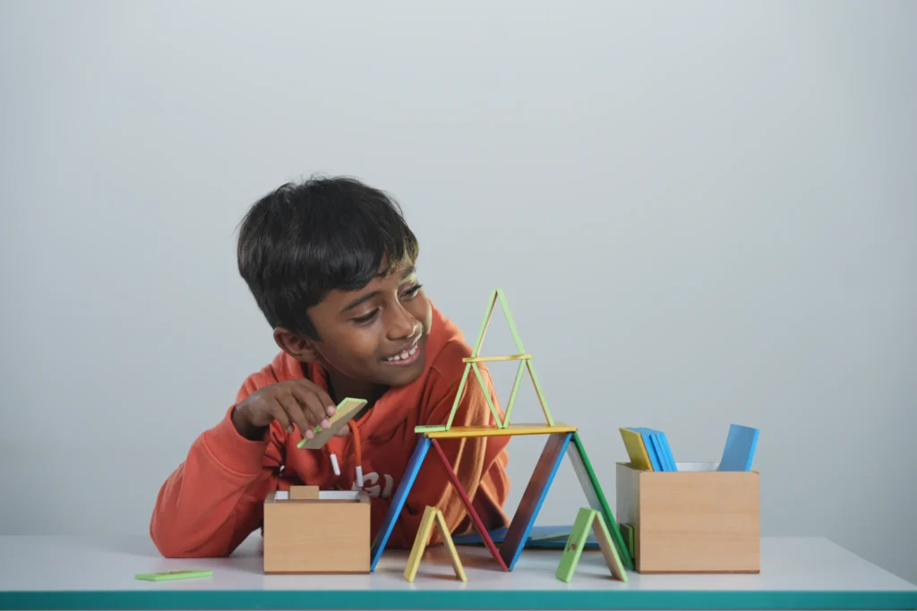 Child playing with educational blocks at QMIS